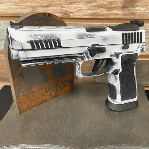 Custom patterned Cerakote finish on a competition-style pistol.