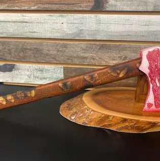 A metal axe head refinished in a custom Cerakote color.