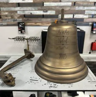 A metal bell refinished with a durable Cerakote coating.
