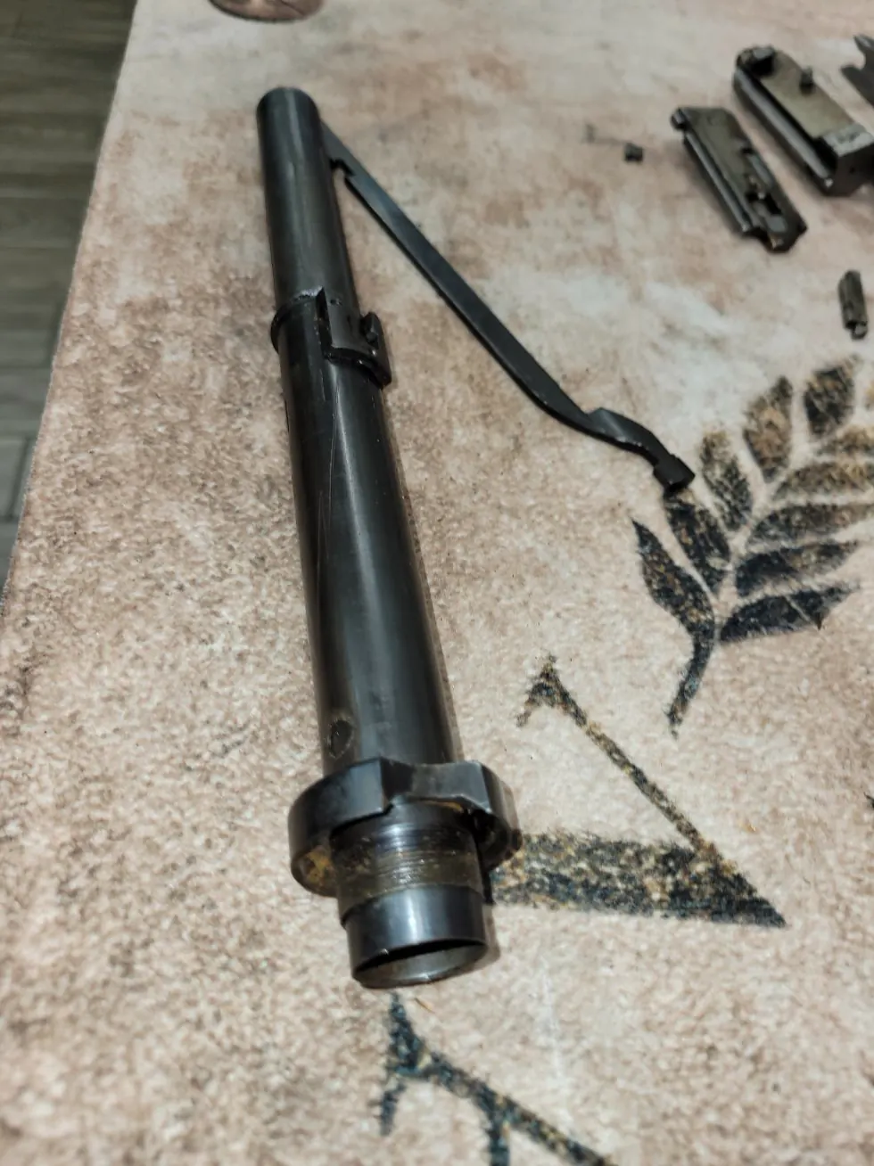 Detailed bench work on a firearm component at Chandler Tactical.