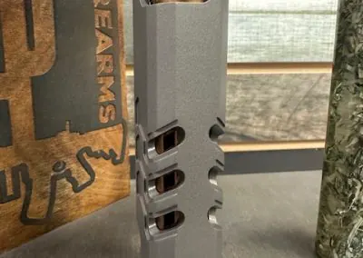 Close view of barrel ports aligned to Kimber 2K11 slide windows.