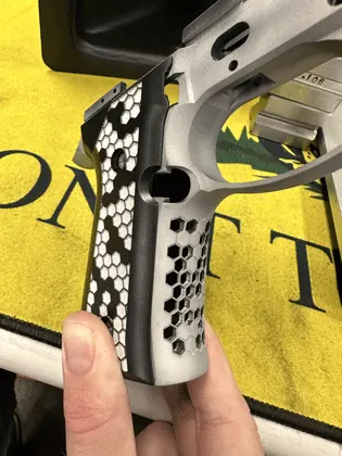 Hexagonal laser pattern applied to a Beretta pistol.