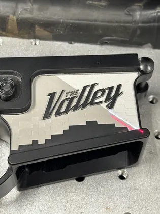 Precision Valley-pattern laser work on a firearm component.