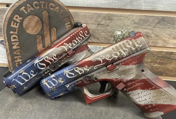A flag-inspired custom finish package on two pistols.
