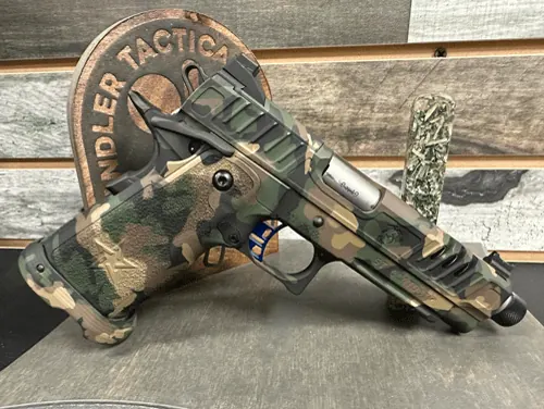 A coordinated custom package on a Prodigy-style pistol.