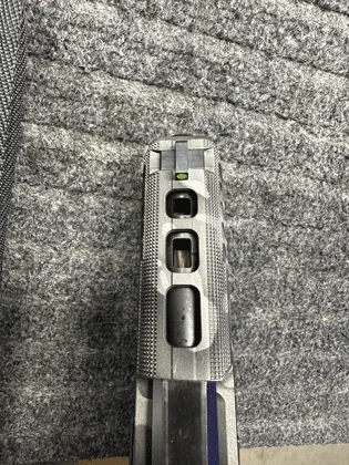 A coordinated slide and barrel porting treatment.